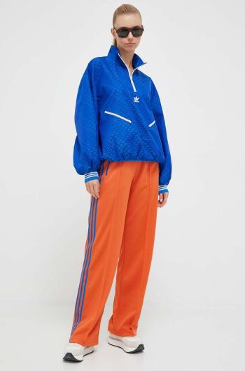 Tepláky adidas Originals oranžová farba, vzorované