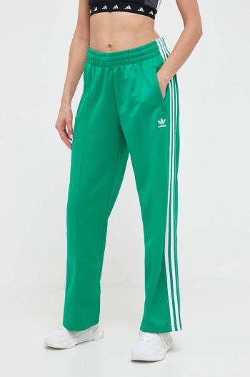 Tepláky adidas Originals zelená farba, s nášivkou