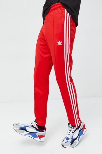 Tepláky adidas Originals pánske, červená farba, vzorované