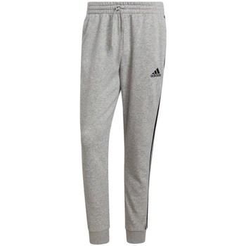 adidas  Nohavice Essentials Fleece Tapered Cuff 3STRIPES  Šedá