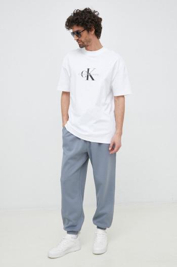 Tepláky Calvin Klein Jeans šedá farba, s nášivkou
