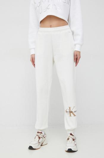 Tepláky Calvin Klein Jeans dámske, béžová farba, s potlačou