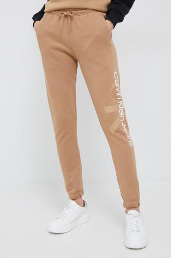 Tepláky Calvin Klein Jeans dámske, béžová farba, jednofarebné