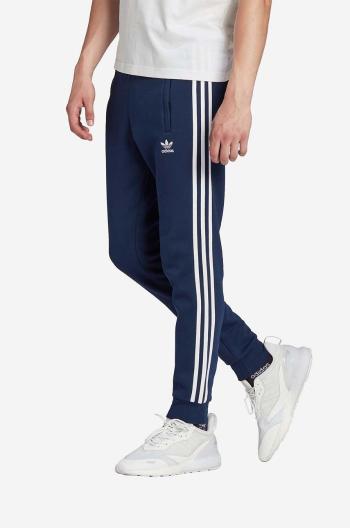 Tepláky adidas Originals tmavomodrá farba, s nášivkou