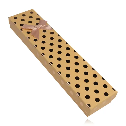 Podlhovastá oranžová krabička na náramok s ružovou mašľou a bodkami