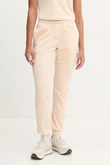 Tepláky Guess béžová farba, s nášivkou