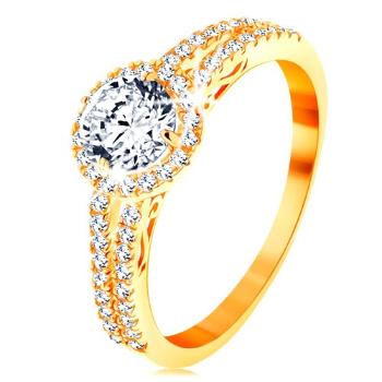Prsteň zo žltého 14K zlata - číry zirkón s ligotavým lemom, zdobené ramená - Veľkosť: 54 mm