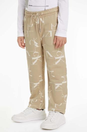Detské bavlnené tepláky Calvin Klein Jeans TERRY JOGGER béžová farba, vzorované, IB0IB02124