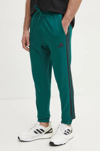 Tepláky adidas Essentials zelená farba, vzorované, JD1879