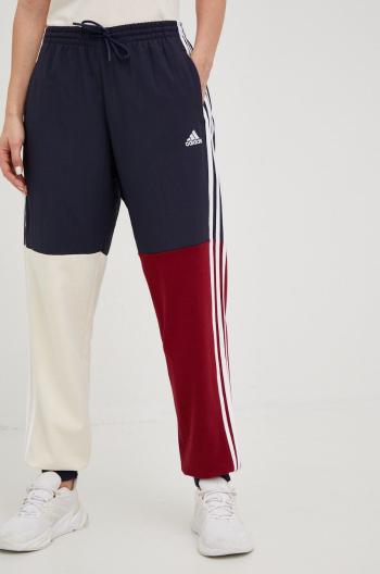 Tepláky adidas Essentials dámske, tmavomodrá farba, vzorované