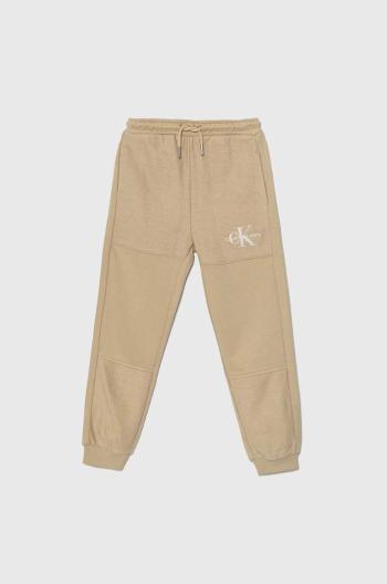 Detské tepláky Calvin Klein Jeans TERRY JOGGER béžová farba, jednofarebné, IB0IB02119