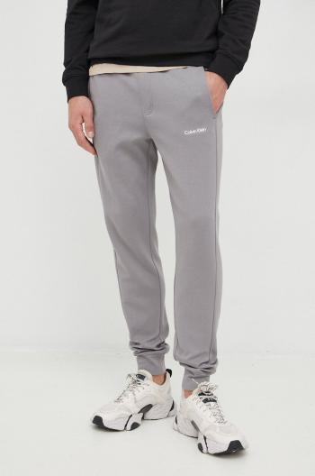 Tepláky Calvin Klein pánske,šedá farba,jednofarebné,K10K109940