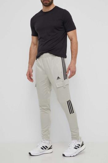 Tepláky adidas TIRO zelená farba, s nášivkou, IS1544