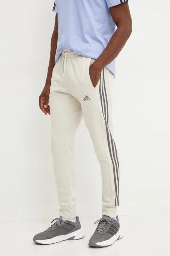 Bavlnené tepláky adidas Essentials béžová farba, vzorované, IW7682