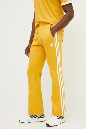 Tepláky adidas Originals 70S Track Pant žltá farba, s nášivkou, IX5223