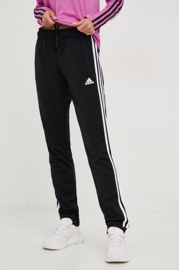 Tepláky adidas dámske, čierna farba, s nášivkou