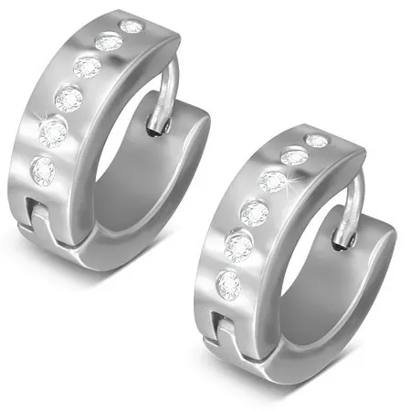 Kĺbové oceľové náušnice striebornej farby, línia okrúhlych čírych zirkónov