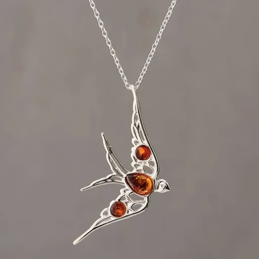 Strieborný náhrdelník s jantárovým príveskom lastovička