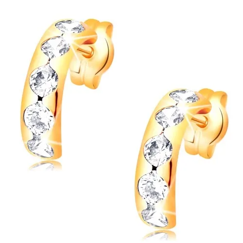 Náušnice zo žltého 14K zlata - oblúk s okrúhlymi výrezmi a čírymi zirkónmi