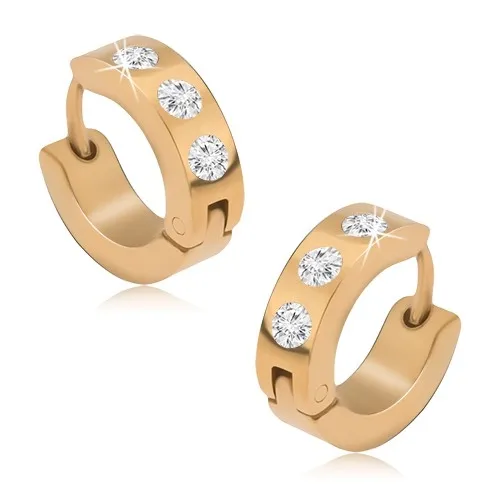 Okrúhle oceľové náušnice zlatej farby, tri okrúhle číre kamienky