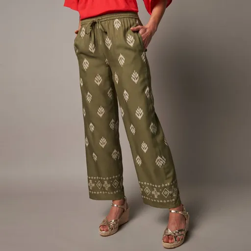 Široké nohavice s vysokým pružným pásom a potlačou